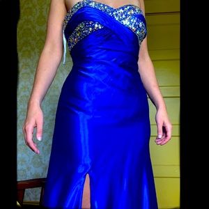Strapless Prom dress with rhinestones at the top.